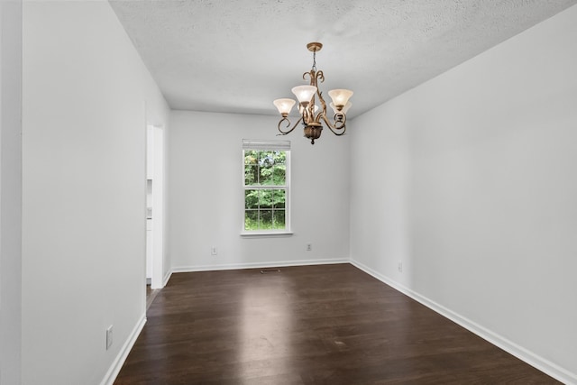 929 Chaparral Dr, Lebanon, TN 37087 - spare room with a chandelier, dark wood-style flooring, baseboards, and a textured ceiling
