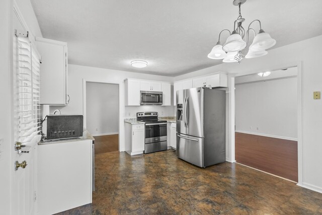 929 Chaparral Dr, Lebanon, TN 37087 - kitchen with stainless steel appliances, light countertops, white cabinetry, a chandelier, and decorative light fixtures