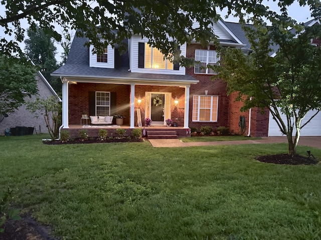 146 Fieldcrest Cir, Hendersonville, TN 37075 - view of front of property featuring covered porch, brick siding, a front lawn, a garage, and roof with shingles