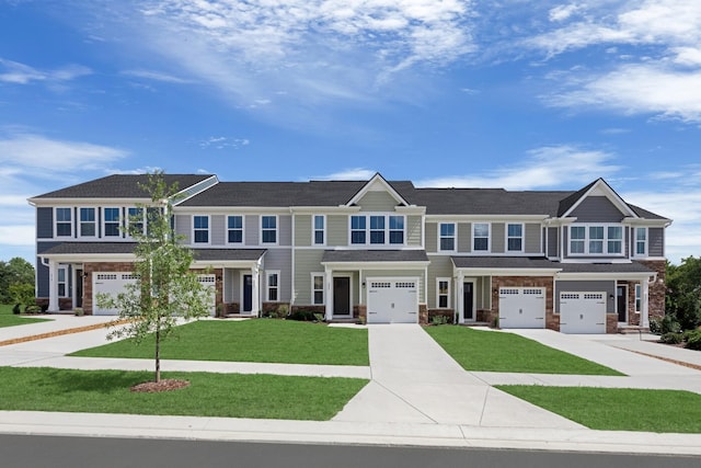 105 Primrose Ln, Gallatin, TN 37066 - townhome / multi-family property featuring a garage, concrete driveway, and a front yard
