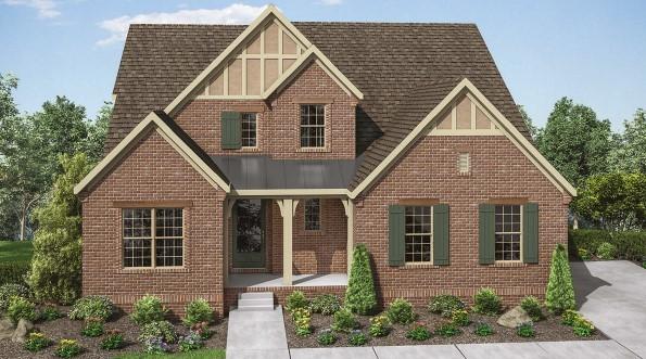 7890 Lampley Rd, Primm Springs, TN 38476 - tudor home with brick siding, a porch, and a shingled roof