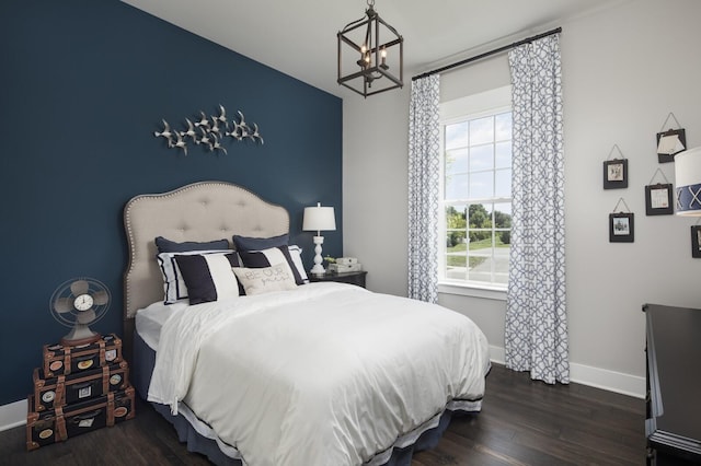 7890 Lampley Rd, Primm Springs, TN 38476 - bedroom with a chandelier, baseboards, and dark wood finished floors
