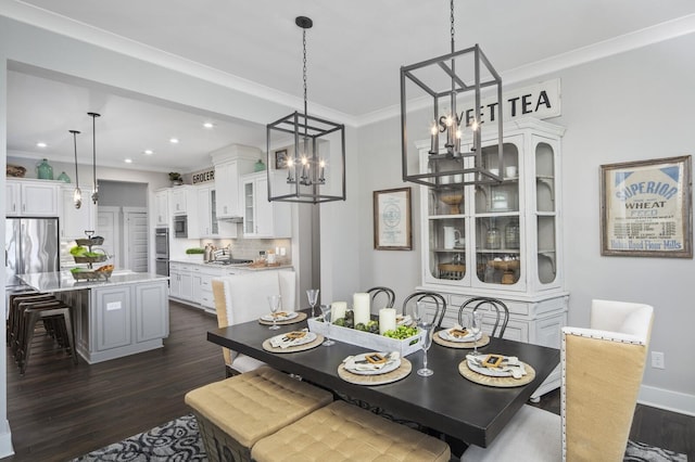 7890 Lampley Rd, Primm Springs, TN 38476 - dining room with dark wood finished floors, crown molding, recessed lighting, a chandelier, and baseboards