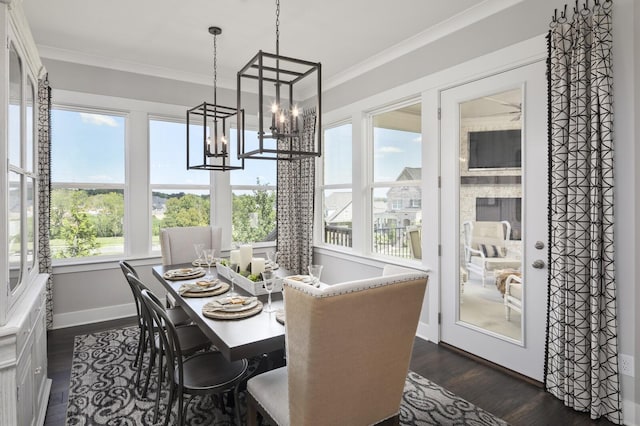 7890 Lampley Rd, Primm Springs, TN 38476 - dining space featuring ornamental molding, dark wood-style flooring, a chandelier, and baseboards