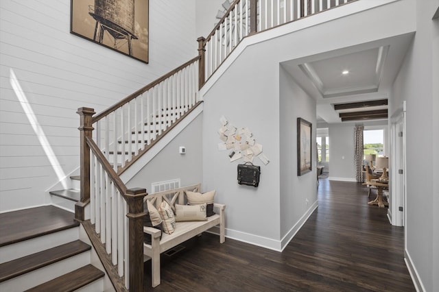 7890 Lampley Rd, Primm Springs, TN 38476 - staircase featuring wood finished floors, baseboards, a tray ceiling, and recessed lighting