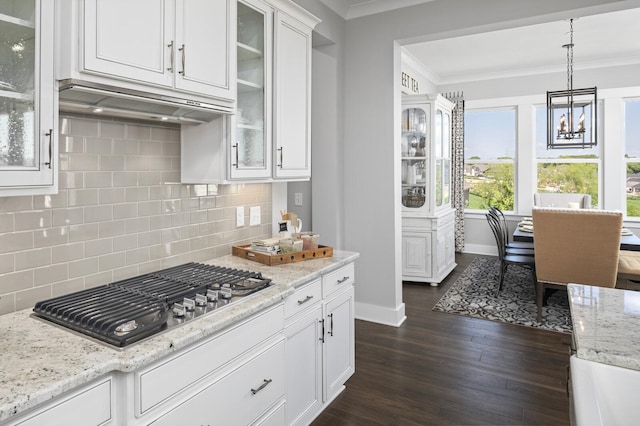 7890 Lampley Rd, Primm Springs, TN 38476 - kitchen featuring stainless steel gas cooktop, ornamental molding, white cabinetry, backsplash, and baseboards