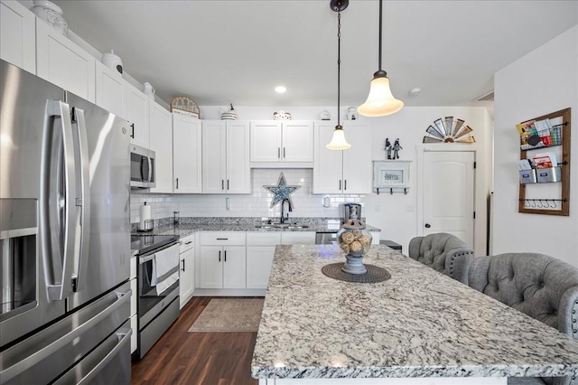 2183 Nectar Ln, Columbia, TN 38401 - kitchen featuring appliances with stainless steel finishes, a sink, dark wood-type flooring, and white cabinetry