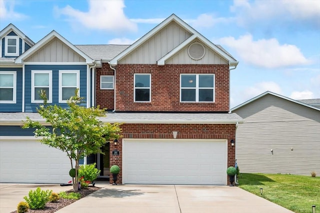 2183 Nectar Ln, Columbia, TN 38401 - view of front facade featuring board and batten siding, driveway, a shingled roof, brick siding, and an attached garage