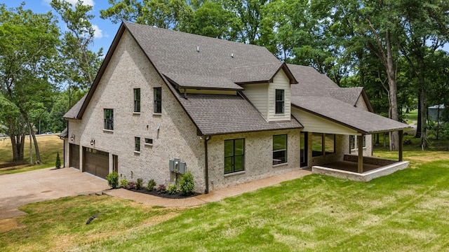 333 Burris Rd, Mount Juliet, TN 37122 - back of property featuring a garage, driveway, roof with shingles, a yard, and brick siding