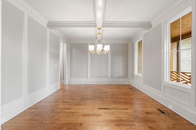 333 Burris Rd, Mount Juliet, TN 37122 - unfurnished dining area with a chandelier, a decorative wall, ornamental molding, coffered ceiling, and light wood-style floors