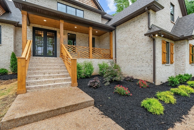 333 Burris Rd, Mount Juliet, TN 37122 - doorway to property featuring a porch, brick siding, and a shingled roof