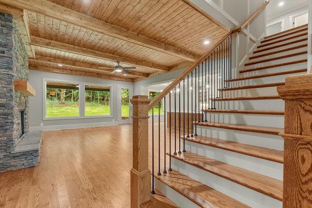 333 Burris Rd, Mount Juliet, TN 37122 - stairs featuring wood finished floors, a fireplace, a ceiling fan, wooden ceiling with exposed beams, and plenty of natural light