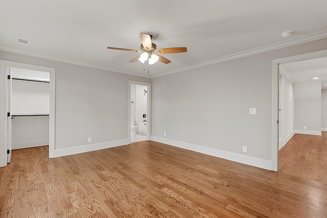 333 Burris Rd, Mount Juliet, TN 37122 - unfurnished bedroom with light wood finished floors, baseboards, a walk in closet, ornamental molding, and connected bathroom