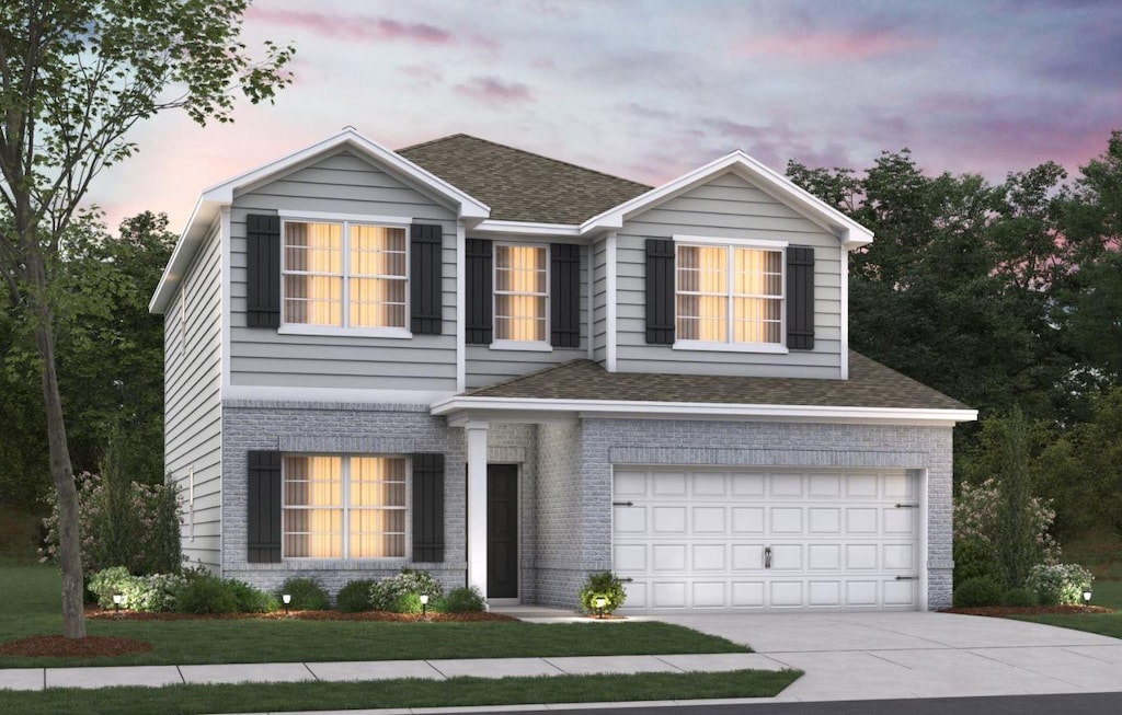 2011M Strong St, Columbia, TN 38401 - traditional-style house with a garage, driveway, roof with shingles, and brick siding