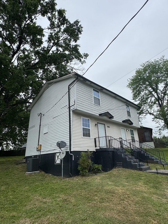 2408 Woodale Ln, Nashville, TN 37207 - rear view of property featuring central AC and a lawn