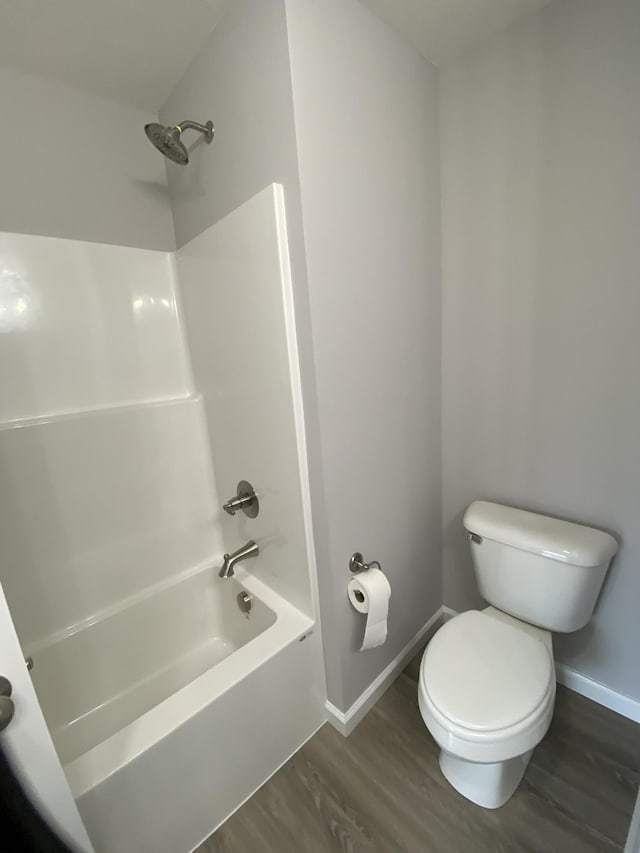 100 Wt Hardison Ave, Portland, TN 37148 - full bathroom featuring toilet, baseboards, wood finished floors, and shower / bath combination