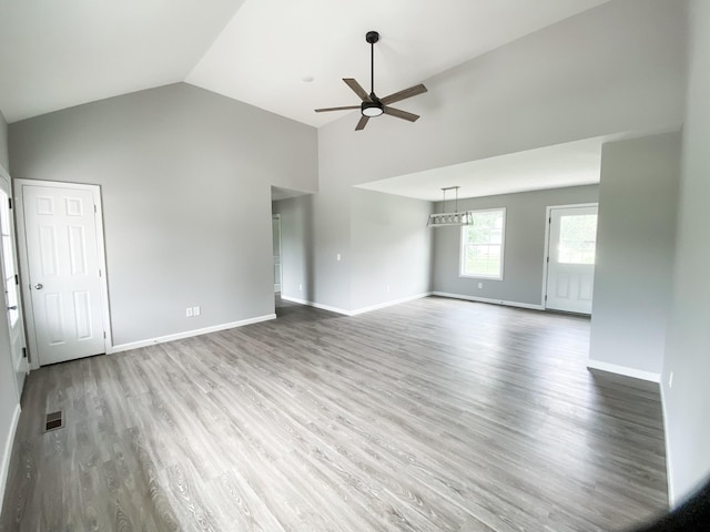 100 Wt Hardison Ave, Portland, TN 37148 - unfurnished living room featuring ceiling fan, high vaulted ceiling, wood finished floors, and baseboards