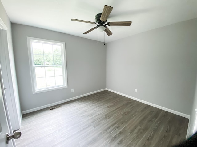 100 Wt Hardison Ave, Portland, TN 37148 - spare room featuring wood finished floors, baseboards, and ceiling fan