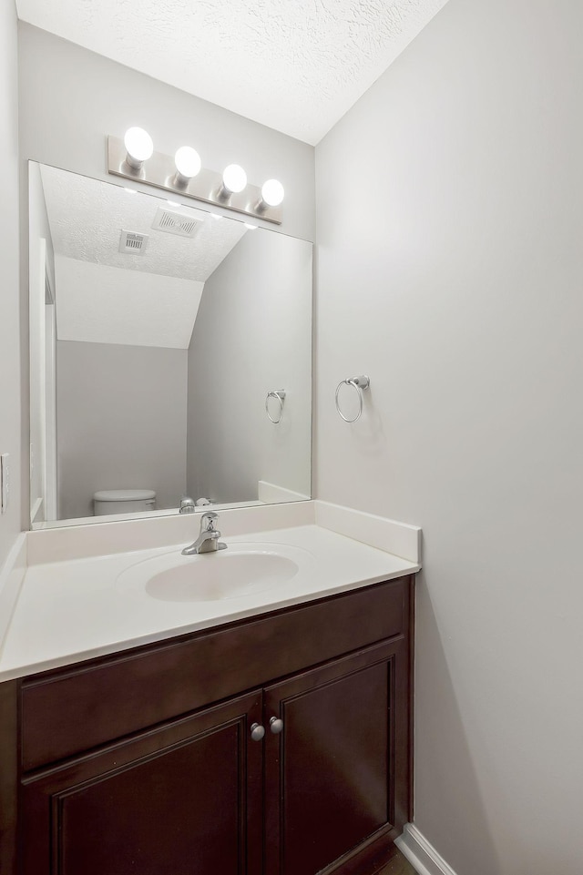 2012 Arum Ct, Spring Hill, TN 37174 - half bath featuring vanity, a textured ceiling, and toilet