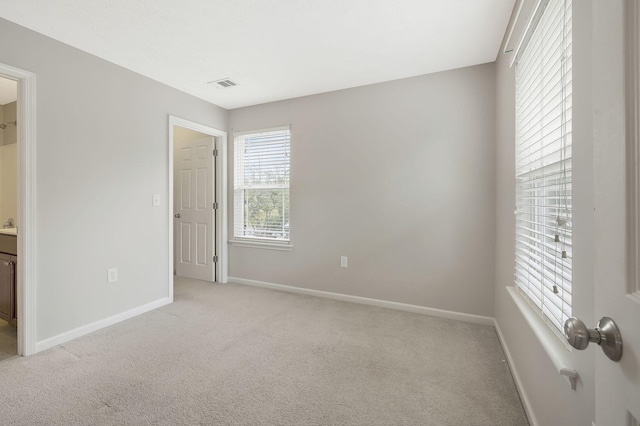 2012 Arum Ct, Spring Hill, TN 37174 - unfurnished bedroom with light carpet, baseboards, and ensuite bathroom