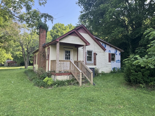 662 Happy Hollow Rd, Goodlettsville, TN 37072 - bungalow-style house with a chimney and a front yard