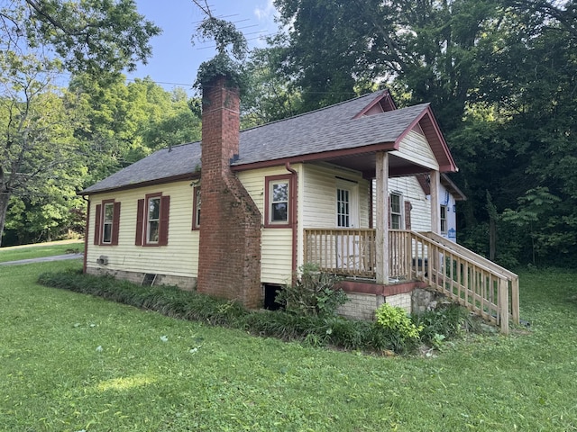 662 Happy Hollow Rd, Goodlettsville, TN 37072 - view of side of property with a yard, a shingled roof, and a chimney