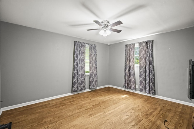 225 Nelson Dr, La Vergne, TN 37086 - unfurnished room with plenty of natural light, ceiling fan, wood finished floors, and baseboards