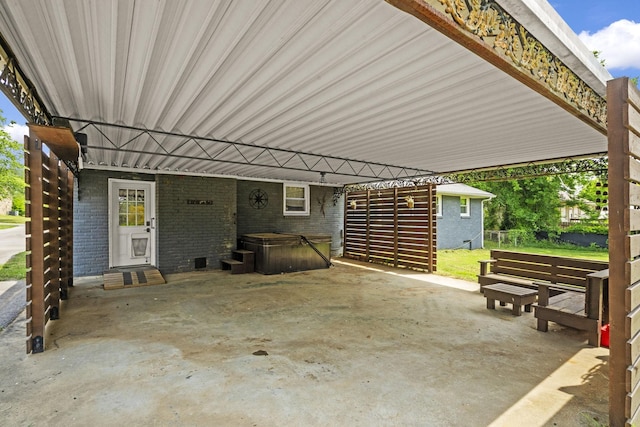 225 Nelson Dr, La Vergne, TN 37086 - view of patio featuring a hot tub and a carport