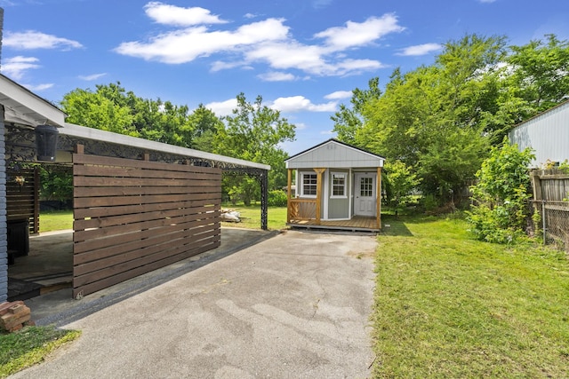 225 Nelson Dr, La Vergne, TN 37086 - view of patio with an outdoor structure and driveway