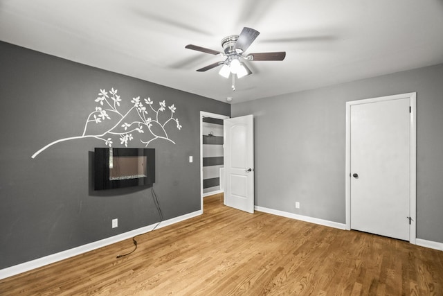 225 Nelson Dr, La Vergne, TN 37086 - unfurnished bedroom with wood finished floors, baseboards, and ceiling fan