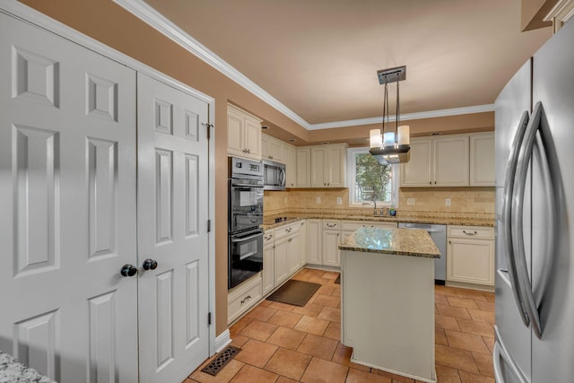 1321 Robert E Lee Ln, Brentwood, TN 37027 - kitchen with black appliances, decorative backsplash, crown molding, light stone countertops, and a kitchen island