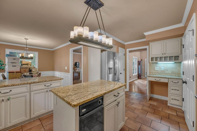 1321 Robert E Lee Ln, Brentwood, TN 37027 - kitchen featuring stainless steel fridge, a chandelier, decorative backsplash, crown molding, and a kitchen island