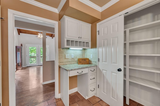 1321 Robert E Lee Ln, Brentwood, TN 37027 - kitchen featuring ornamental molding, light stone counters, white cabinets, backsplash, and open shelves