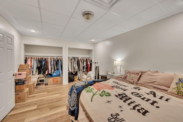 1321 Robert E Lee Ln, Brentwood, TN 37027 - bedroom with a drop ceiling, light wood-type flooring, and two closets