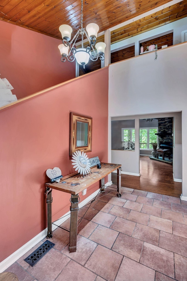 1321 Robert E Lee Ln, Brentwood, TN 37027 - hall with wood ceiling, a chandelier, and stone tile flooring