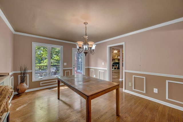 1321 Robert E Lee Ln, Brentwood, TN 37027 - dining space featuring a chandelier, wood finished floors, ornamental molding, and wainscoting