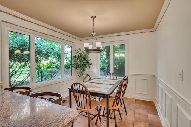 1321 Robert E Lee Ln, Brentwood, TN 37027 - dining area with a decorative wall, a chandelier, crown molding, wainscoting, and light tile patterned flooring