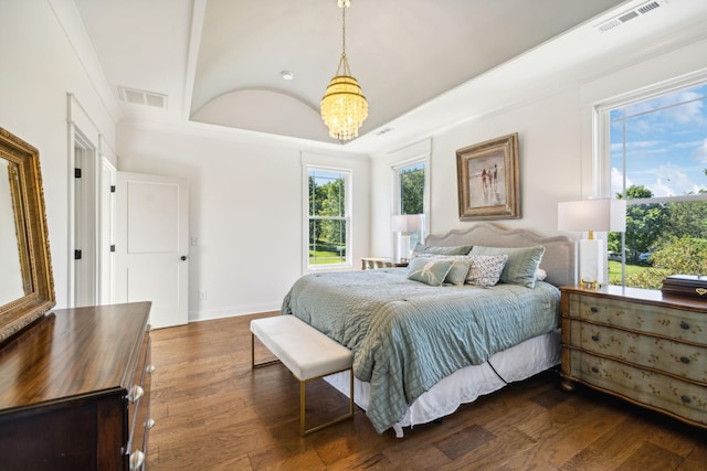 8226 Frontier Ln, Brentwood, TN 37027 - bedroom with a chandelier, dark wood finished floors, and baseboards