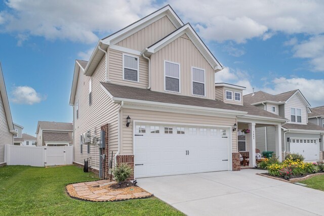1605 Medinah Ln, Lebanon, TN 37087 - view of front of house with board and batten siding, an attached garage, and concrete driveway