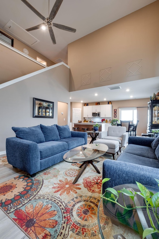 1605 Medinah Ln, Lebanon, TN 37087 - living area featuring a towering ceiling, ceiling fan, attic access, and wood finished floors