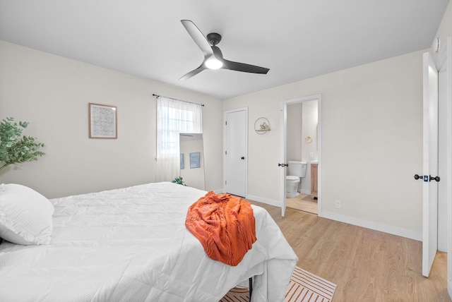 415 Jordan Rd, Clarksville, TN 37042 - bedroom with light wood-type flooring, connected bathroom, and ceiling fan