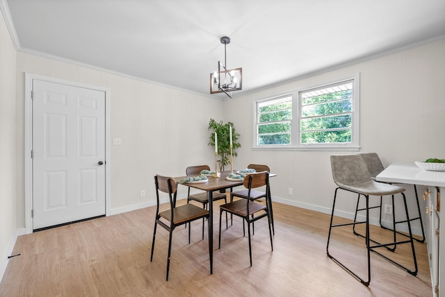 415 Jordan Rd, Clarksville, TN 37042 - dining room with crown molding, light wood-style flooring, and a chandelier