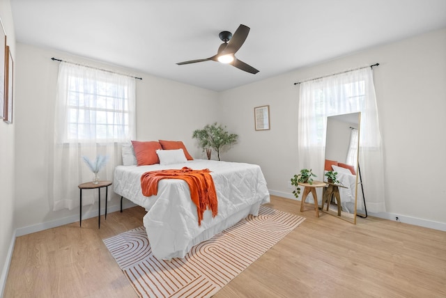 415 Jordan Rd, Clarksville, TN 37042 - bedroom featuring light wood-style floors, multiple windows, and ceiling fan