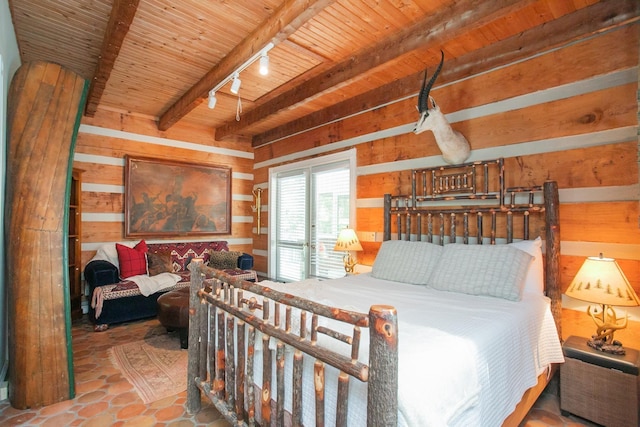 1105 Mount Pleasant Rd, Kingston Springs, TN 37082 - bedroom with wooden ceiling with exposed beams, wood walls, and track lighting