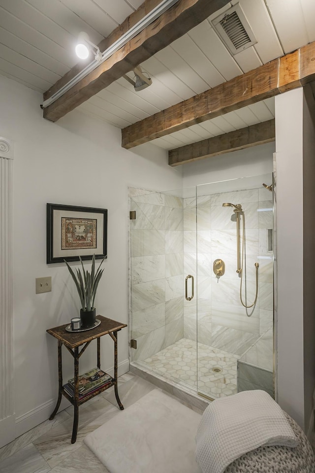 1105 Mount Pleasant Rd, Kingston Springs, TN 37082 - bathroom featuring a stall shower, baseboards, beam ceiling, and marble finish floors
