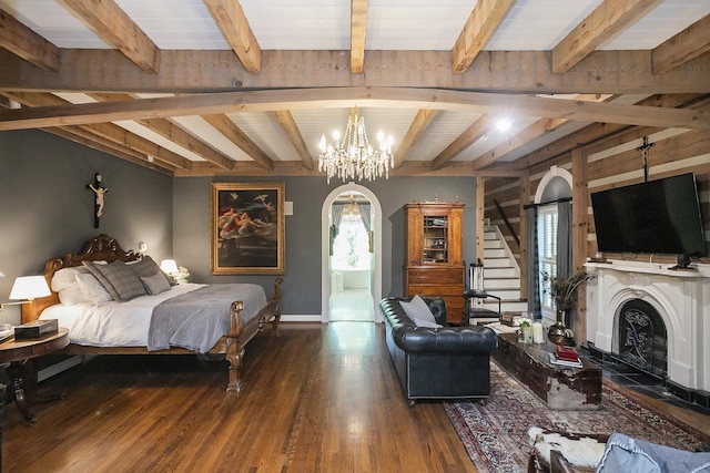 1105 Mount Pleasant Rd, Kingston Springs, TN 37082 - bedroom with a chandelier, beam ceiling, wood finished floors, baseboards, and a fireplace