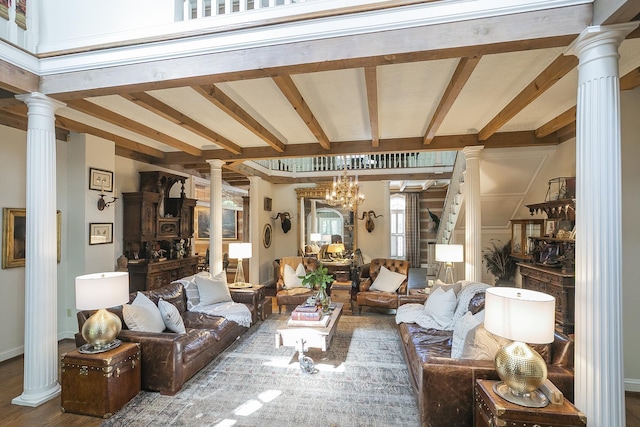 1105 Mount Pleasant Rd, Kingston Springs, TN 37082 - living area featuring decorative columns, beam ceiling, wood finished floors, a chandelier, and baseboards