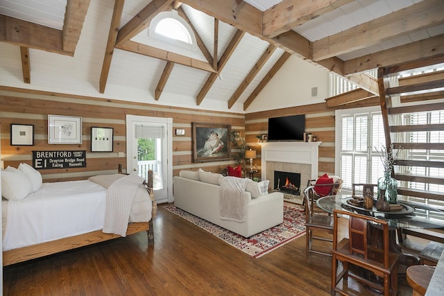 1105 Mount Pleasant Rd, Kingston Springs, TN 37082 - bedroom featuring wood walls, a fireplace, wood finished floors, high vaulted ceiling, and beam ceiling