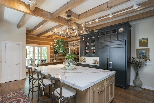 1105 Mount Pleasant Rd, Kingston Springs, TN 37082 - kitchen with paneled built in refrigerator, dark wood-style floors, a center island, baseboards, and wooden ceiling with exposed beams