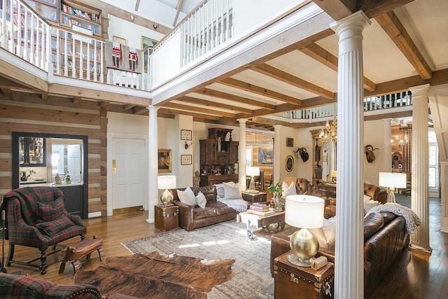 1105 Mount Pleasant Rd, Kingston Springs, TN 37082 - living area with ornate columns, wood finished floors, beamed ceiling, and a towering ceiling